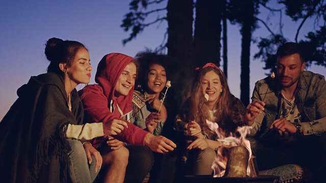 Happy Young Group Of Teen Campers In The Woods At Dusk Taking A Selfie Laughing And Joking Vacation Technology In Nature Romantic Getaway Concept Slow Motion Shot On Red Epic W