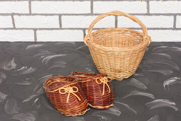 Products wicker made of natural vine. Decorative basket and slippers for home interior. Hand made,...