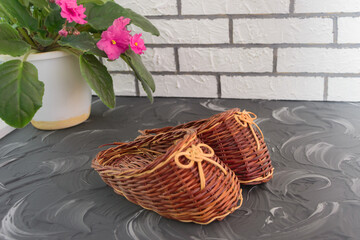 Souvenir shoes or slippers woven from natural vine. Home decoration. Hand made, selective focus