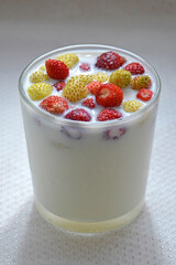 A glass of milk with strawberries. Fruit healthy natural drink.