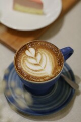 A close up of a cup of latte