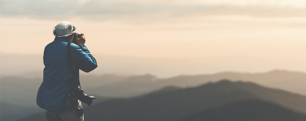 nature photographer shoots a mountain landscape