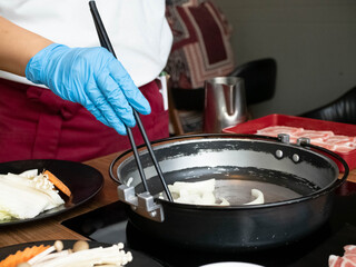 Chef resturant kitchen wear glove mask blue is cooking chopstick shabu suki buffet healthy  vegetable potk seafood beef customer asain japanese korean china eat warm hot for protect covid-19 disease