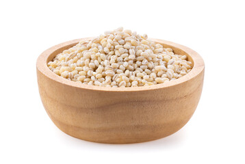 pile of pearl barley in wood bowl on white background