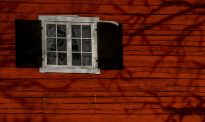 window in the old red wall