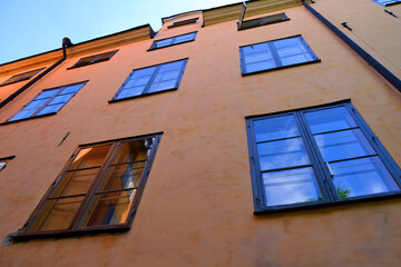 Facade of an old orange building in the Old Town of Stockholm, Sweden