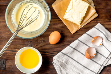 cooking pancake on wooden background top view ingredients for making