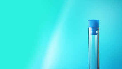 One test tube against blurred blue background