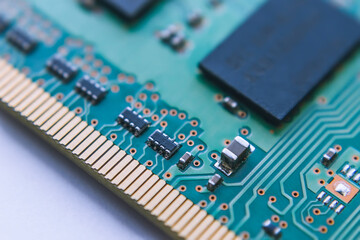 Close-up of resistors, capacitors and other electronic components located on a computer memory...