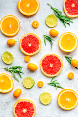 sliced citrus pattern on stone table background top view