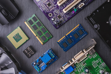 Computer hardware configuration is laid out on a dark background. Concept of a modern solid-state digital technology