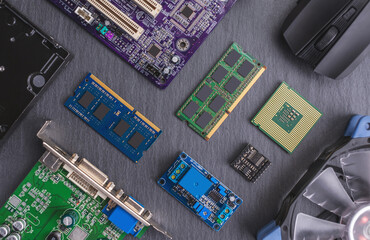 Computer hardware configuration is laid out on a dark background. Concept of a modern solid-state...