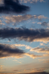 Rain clouds in the sky at sunset