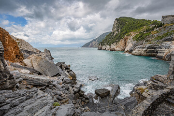 Fototapeta na wymiar Cliff sea coast with Grotta di Lord Byron in Portovenere or Porto Venere town on Ligurian coast. Province of La Spezia. Italy