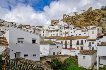 Fototapeta na wymiar Traditional white village in inland of Spain. It's called Pueblos Blancos in spanish. White houses on the rocks.