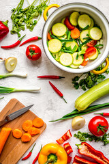 cooking vegetables on the stone background top view