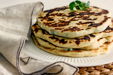 Homemade wheat cakes with cheese filling, close-up. Filled flat bread