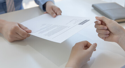 Applicants submitting a resume to the staff to apply for a job, Participating in the selection of applicants to work in the company, Submitting documents or submitting a resume.