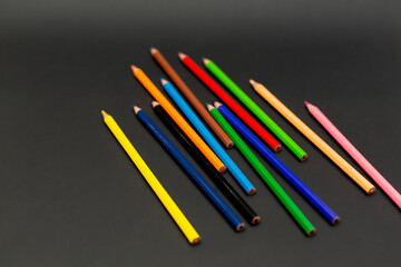 We color wooden pencils. Black background.