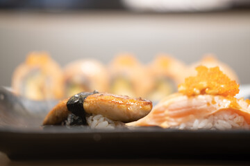 Salmon sushi and foie gras sushi. Fusion Japanese Cuisine food,