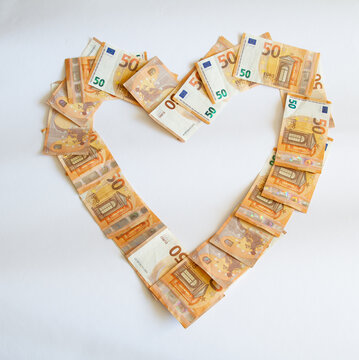 Heart shaped empty frame made with many 50 euro banknotes isolated, Valentines day concept.