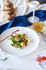 salad of shrimp, cheese, dandelion leaves and tomatoes
