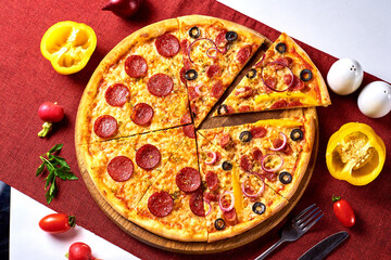 half pizza with sausage and the other half with onions, olives, and sausages