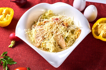 Caesar salad in a white plate