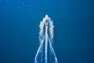 Motor boat in the sea. Aerial view luxury motor boat. Drone view of a boat sailing. Top view of a...