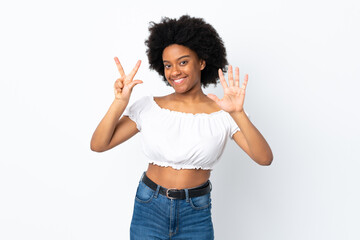 Young African American woman isolated on white background counting eight with fingers