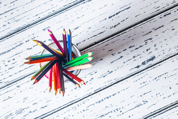 Colorful pencils in a metal stand