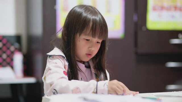 Children do their homework, erase mistakes correcting picture or answer in notepad with eraser in home ,Kid education concept