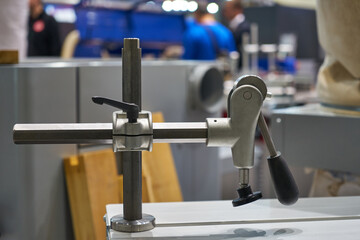 The image of the clamp for fastening the panels on the coordinate-milling woodworking machine with CNC.