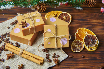 Obraz na płótnie Canvas Bright handmade soap, various spices on the wooden countertop. Healthy lifestyle, natural products.