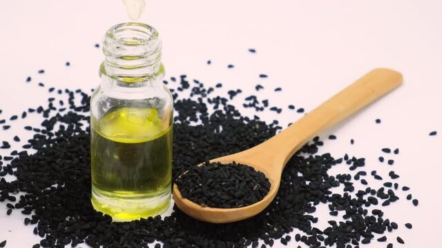 essential oil of black cumin in small bottles. selective focus.