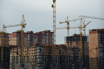 Houses under construction in a residential complex.