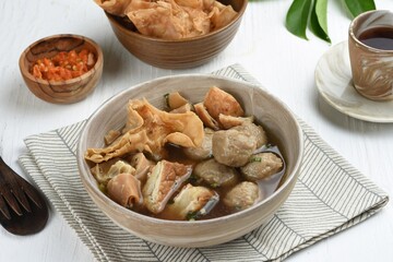 Bakso Malang is a typical Malang meatball with additional toppings such as fried dumplings, tofu, fried meatballs and somay