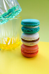 colored macaroons on a yellow background
