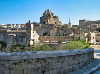 Fototapeta na wymiar View of stone houses and basilica in the historic center of Matera. Basilicata. Italy. Europe