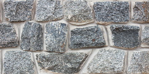 Textured gray stone wall background