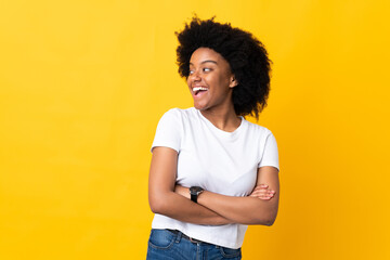 Young African American woman isolated on yellow background happy and smiling
