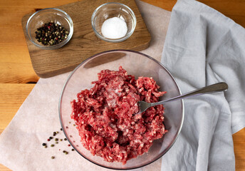 Ground beef meat from fresh meat salt and pepper for cooking cutlets.