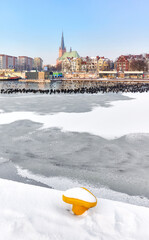 Szczecin waterfront with frozen Odra River in winter, Poland. - obrazy, fototapety, plakaty