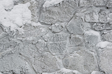 Irregular stone flags, frosted over, seen from above