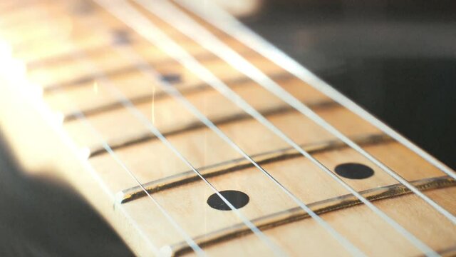 Guitar background stringed instrument electric guitar fretboard and chords detail selective focus panning