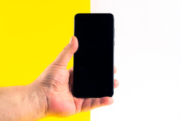 Mock up of a smartphone on different colored backgrounds.