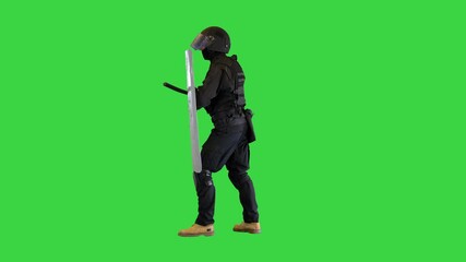 Riot police unit making sound hitting shield with baton on a Green Screen, Chroma Key.