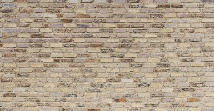 Alte, beige braune, sehr grob gearbeitete Backsteinmauer, gr&ouml;&szlig;tenteils mit heller Farbe &uuml;berstrichen