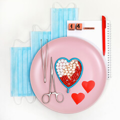 Composition of a dish with medical steel instruments, hearts and medicines, against a background of...