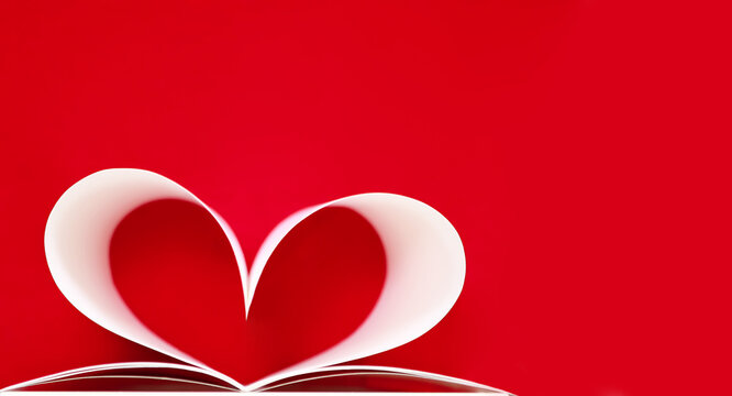 Graceful heart shape made of sheets of white paper on a red background, close-up, shallow depth of field, copy space